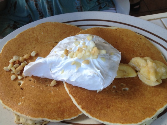 Banana macadamia nut pancakes with juuuuuuuust a dab of whipped cream.
